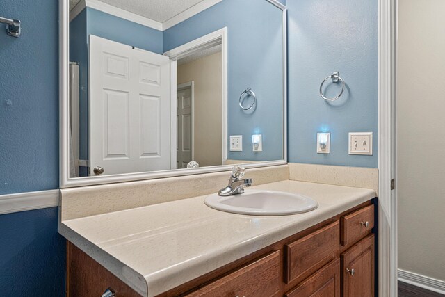 138 Conquest Ave, Crestview, FL 32536 - bathroom with vanity and ornamental molding