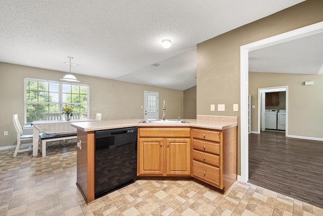 138 Conquest Ave, Crestview, FL 32536 - kitchen with dishwasher, independent washer and dryer, light countertops, a sink, and a peninsula