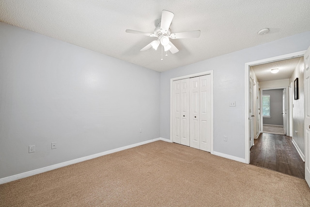 138 Conquest Ave, Crestview, FL 32536 - unfurnished bedroom with carpet flooring, baseboards, a closet, ceiling fan, and a textured ceiling