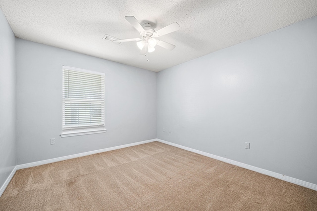 138 Conquest Ave, Crestview, FL 32536 - spare room with carpet, a ceiling fan, baseboards, and a textured ceiling