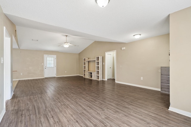 138 Conquest Ave, Crestview, FL 32536 - unfurnished living room with ceiling fan, vaulted ceiling, wood finished floors, and baseboards