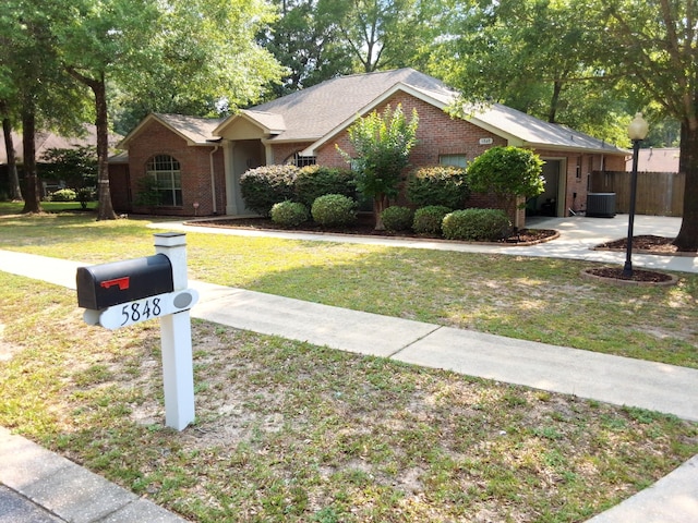 5848 Saratoga Dr, Crestview, FL 32536 - ranch-style house with brick siding, central AC, and a garage