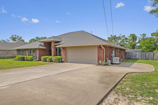 7302 Manatee St, Navarre, FL 32566 - single story home featuring brick siding, a garage, driveway, cooling unit, and roof with shingles