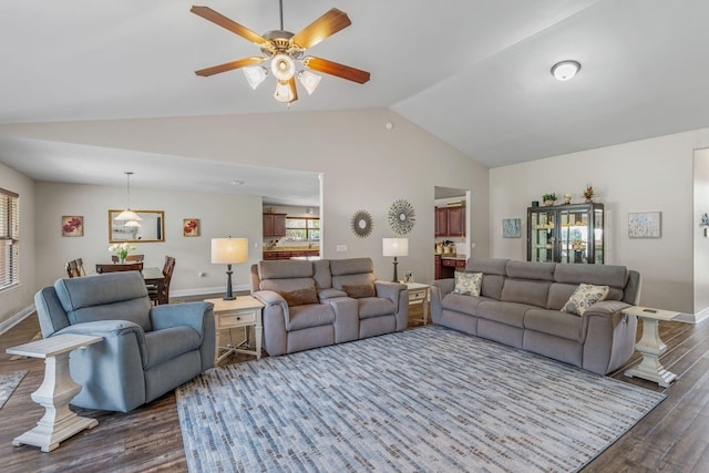 7302 Manatee St, Navarre, FL 32566 - living room featuring dark wood finished floors, lofted ceiling, plenty of natural light, a ceiling fan, and baseboards