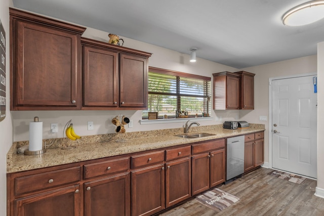 7302 Manatee St, Navarre, FL 32566 - kitchen with a sink, stainless steel dishwasher, light wood-type flooring, and light stone counters
