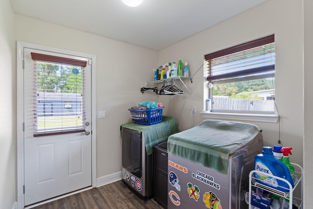 7302 Manatee St, Navarre, FL 32566 - laundry area featuring healthy amount of natural light, dark wood finished floors, washing machine and clothes dryer, and baseboards