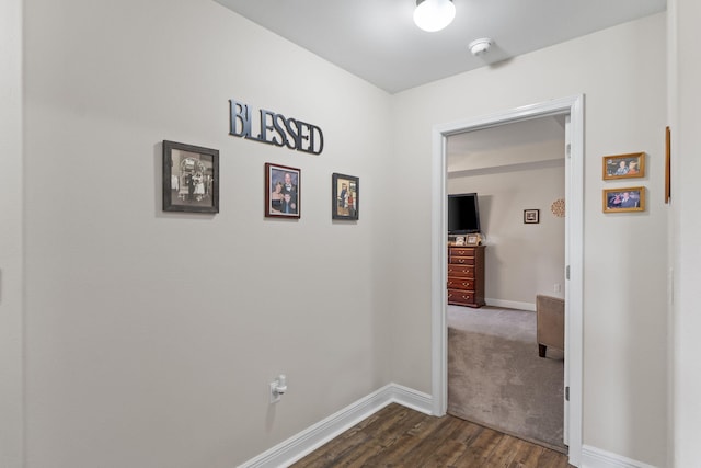 7302 Manatee St, Navarre, FL 32566 - hall with dark wood-style floors and baseboards