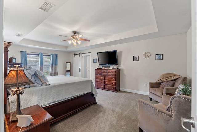 7302 Manatee St, Navarre, FL 32566 - bedroom with a tray ceiling, light carpet, baseboards, and ceiling fan
