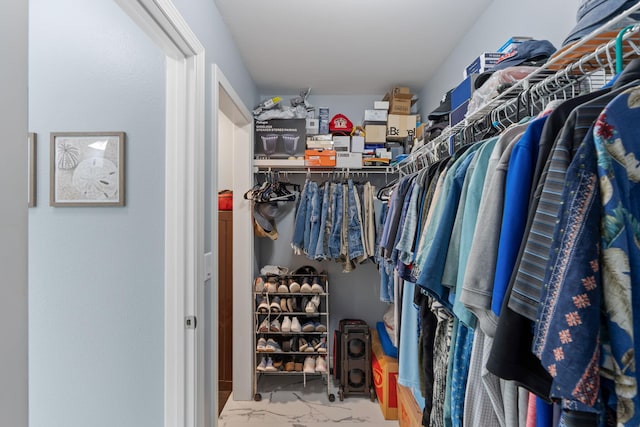 7302 Manatee St, Navarre, FL 32566 - walk in closet featuring marble look tiles