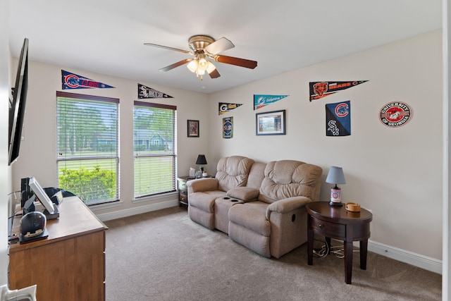 7302 Manatee St, Navarre, FL 32566 - living room featuring ceiling fan, carpet, and baseboards