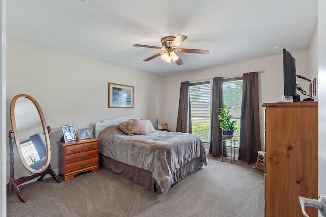 7302 Manatee St, Navarre, FL 32566 - bedroom featuring carpet flooring, multiple windows, and a ceiling fan