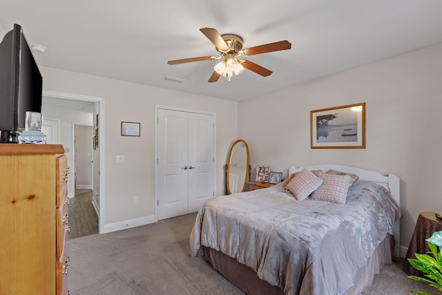 7302 Manatee St, Navarre, FL 32566 - carpeted bedroom with a closet, baseboards, and ceiling fan