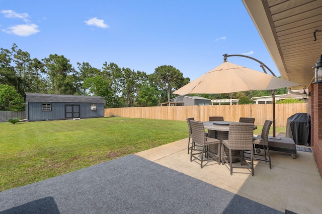 7302 Manatee St, Navarre, FL 32566 - view of patio with outdoor dining area, grilling area, and an outdoor structure
