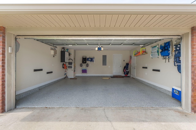 7302 Manatee St, Navarre, FL 32566 - garage with electric panel, baseboards, and a garage door opener