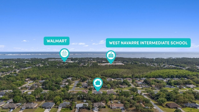 7302 Manatee St, Navarre, FL 32566 - aerial perspective of suburban area featuring a large body of water