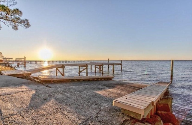 7302 Manatee St, Navarre, FL 32566 - dock featuring a water view and a boat ramp