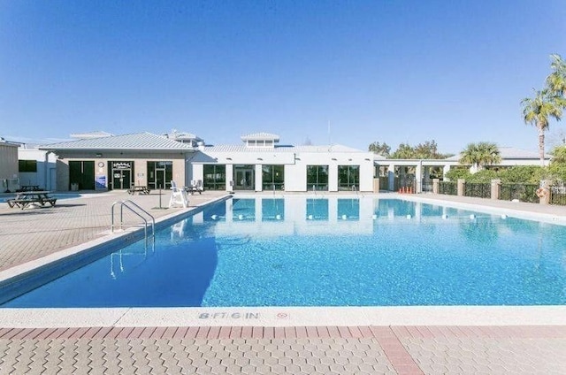7302 Manatee St, Navarre, FL 32566 - community pool with a patio