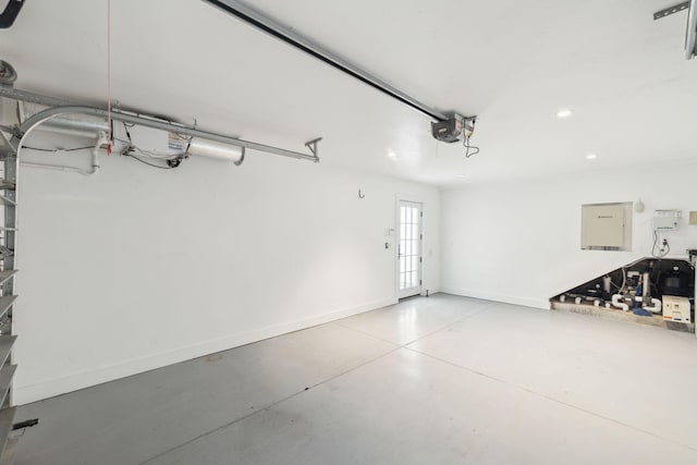 132 N Somerset St, Alys Beach, FL 32461 - garage featuring a garage door opener, recessed lighting, baseboards, electric panel, and french doors