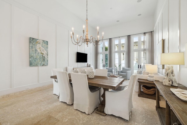 132 N Somerset St, Alys Beach, FL 32461 - dining room with a chandelier and a decorative wall