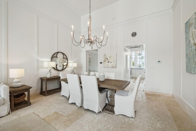 132 N Somerset St, Alys Beach, FL 32461 - dining space with a chandelier and a decorative wall