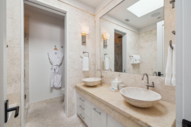 132 N Somerset St, Alys Beach, FL 32461 - bathroom featuring double vanity, backsplash, toilet, and baseboards