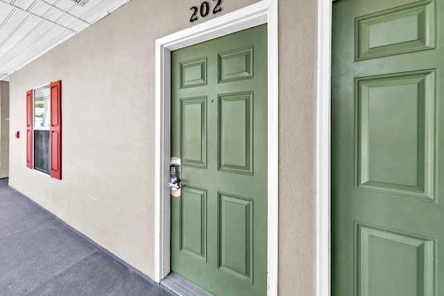 144 Spires Ln Unit 202, Santa Rosa Beach, FL 32459 - doorway to property featuring stucco siding