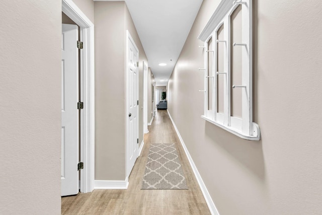 144 Spires Ln Unit 202, Santa Rosa Beach, FL 32459 - corridor with wood finished floors, baseboards, and recessed lighting