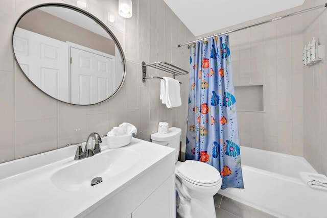 144 Spires Ln Unit 202, Santa Rosa Beach, FL 32459 - full bathroom with tile walls, vanity, toilet, shower / bathtub combination with curtain, and tile patterned floors