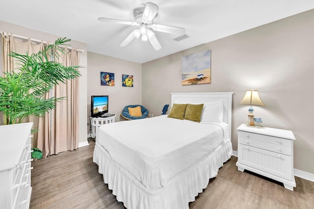 144 Spires Ln Unit 202, Santa Rosa Beach, FL 32459 - bedroom featuring light wood-style flooring, baseboards, and ceiling fan