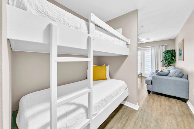 144 Spires Ln Unit 202, Santa Rosa Beach, FL 32459 - bedroom with wood finished floors and baseboards