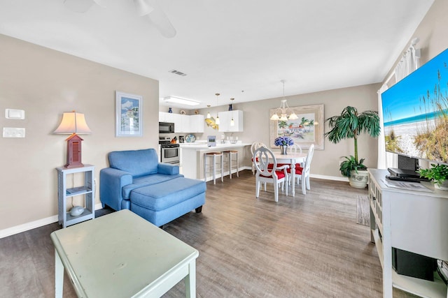 144 Spires Ln Unit 202, Santa Rosa Beach, FL 32459 - living room with baseboards, light wood-type flooring, and plenty of natural light