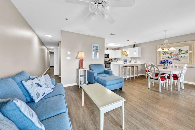 144 Spires Ln Unit 202, Santa Rosa Beach, FL 32459 - living area featuring baseboards, wood finished floors, a ceiling fan, and recessed lighting