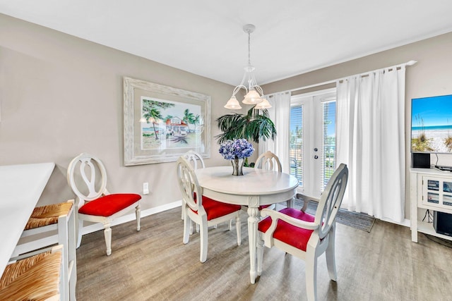 144 Spires Ln Unit 202, Santa Rosa Beach, FL 32459 - dining space with wood finished floors, baseboards, and french doors