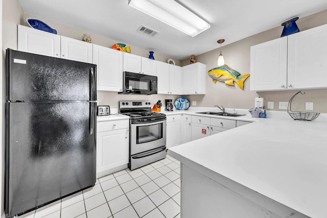 144 Spires Ln Unit 202, Santa Rosa Beach, FL 32459 - kitchen with black appliances, a sink, light countertops, and white cabinets