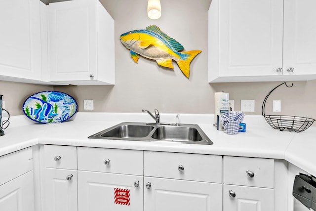 144 Spires Ln Unit 202, Santa Rosa Beach, FL 32459 - kitchen featuring a sink, white cabinets, and light countertops