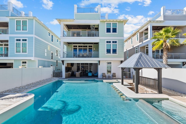 89 Shirah St, Destin, FL 32541 - rear view of house featuring a balcony, a fenced backyard, a gazebo, and a patio area