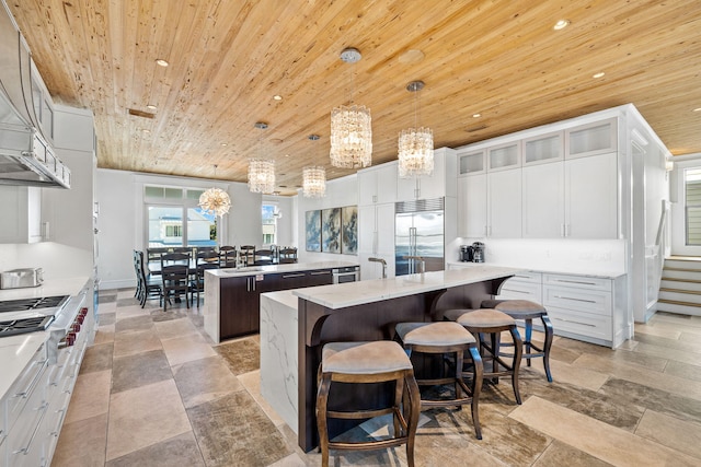 89 Shirah St, Destin, FL 32541 - kitchen with stainless steel appliances, a kitchen island, wooden ceiling, recessed lighting, and hanging light fixtures
