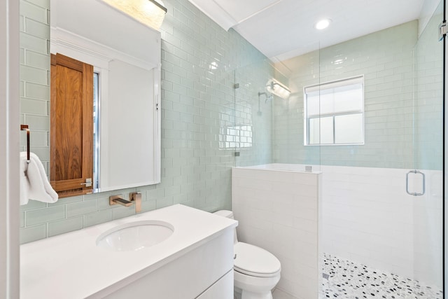 89 Shirah St, Destin, FL 32541 - full bathroom featuring tile walls, a shower stall, toilet, vanity, and recessed lighting