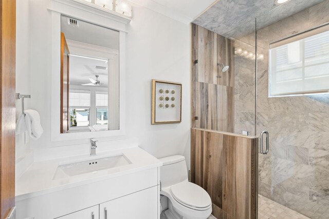 89 Shirah St, Destin, FL 32541 - full bath with vanity, toilet, a shower stall, and a ceiling fan