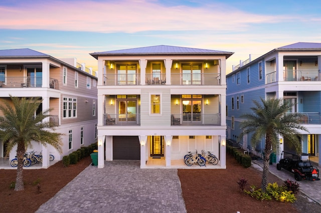 89 Shirah St, Destin, FL 32541 - back of property with a balcony, a garage, driveway, and metal roof
