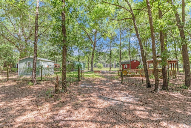 1184 Blackberry Cir, Baker, FL 32531 - view of yard with an outbuilding