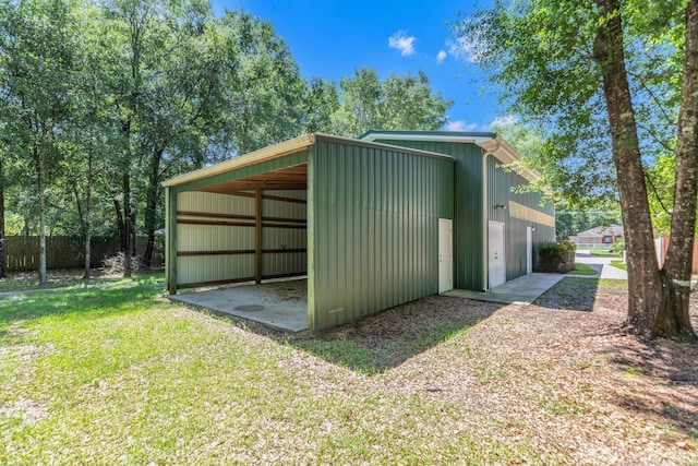 1184 Blackberry Cir, Baker, FL 32531 - view of pole building featuring a carport