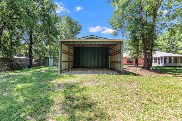1184 Blackberry Cir, Baker, FL 32531 - garage featuring a detached carport and a storage shed
