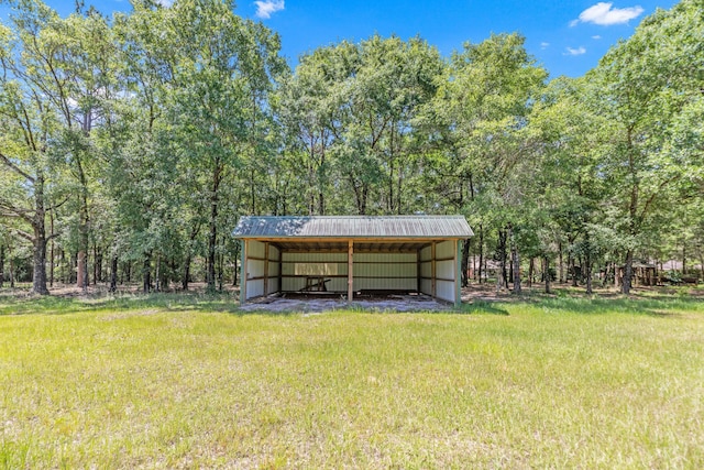 1184 Blackberry Cir, Baker, FL 32531 - view of grassy yard with a pole building, a carport, and an outbuilding
