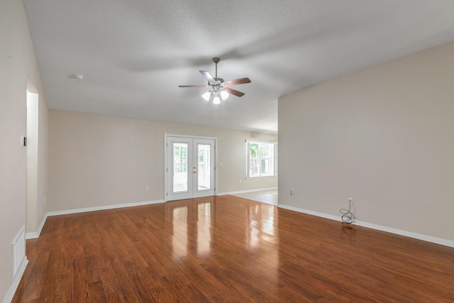 1184 Blackberry Cir, Baker, FL 32531 - spare room featuring a ceiling fan, wood finished floors, baseboards, and french doors