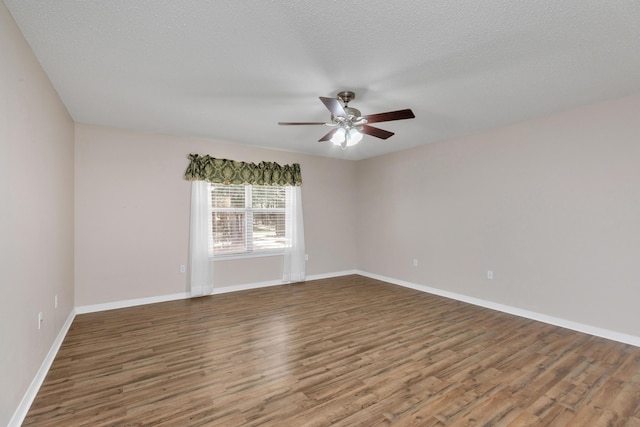 1184 Blackberry Cir, Baker, FL 32531 - empty room with wood finished floors, a ceiling fan, and baseboards