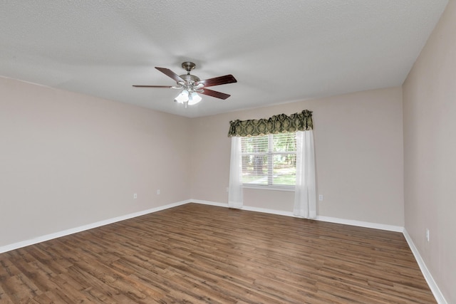 1184 Blackberry Cir, Baker, FL 32531 - spare room featuring wood finished floors, ceiling fan, and baseboards