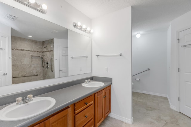 1184 Blackberry Cir, Baker, FL 32531 - bathroom with tiled shower, double vanity, toilet, marble look tiles, and baseboards
