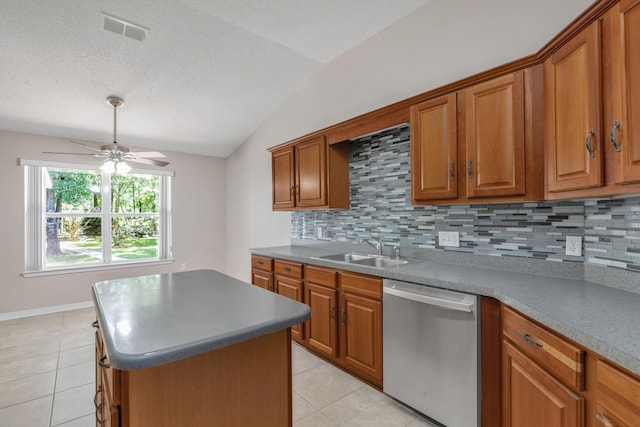 1184 Blackberry Cir, Baker, FL 32531 - kitchen featuring dishwasher, a sink, ceiling fan, tasteful backsplash, and vaulted ceiling