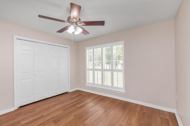 1184 Blackberry Cir, Baker, FL 32531 - unfurnished bedroom with baseboards, light wood finished floors, a closet, and ceiling fan